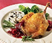 Duck thighs confit with red peppercorn fruit chutney